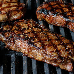 Grill Mates seasoning crusted on a grilled steak, enhances savory char and aroma