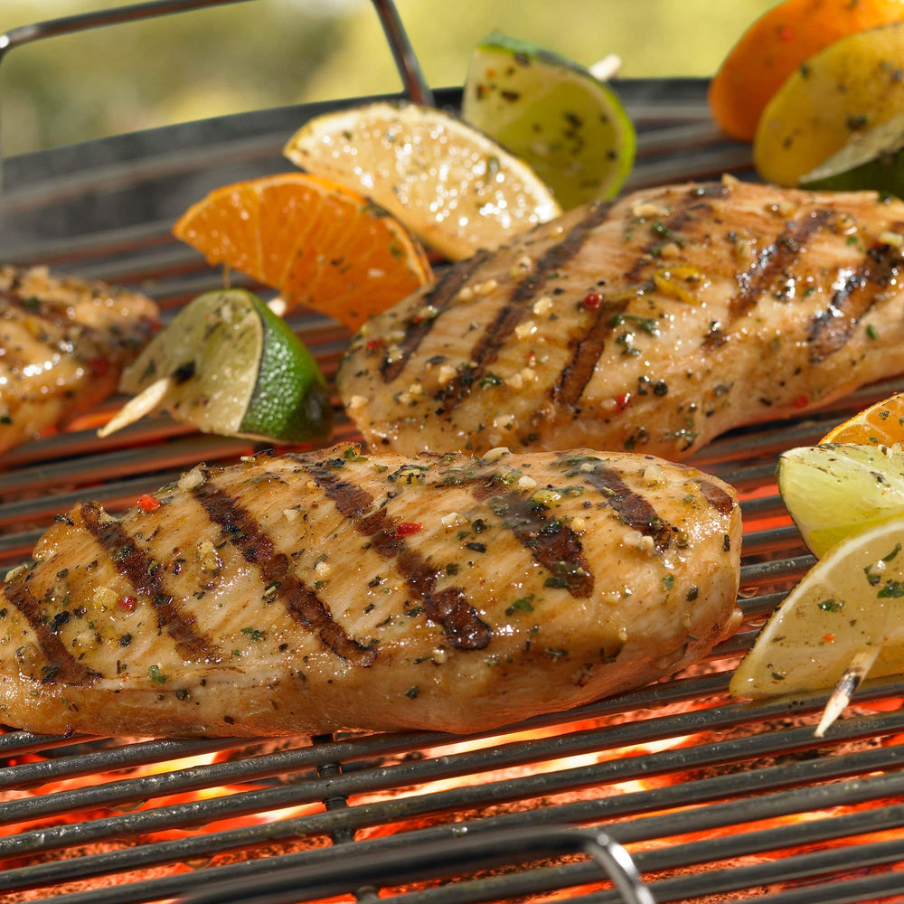 Backyard grill scene using Grill Mates mix to enhance summer cookout meals