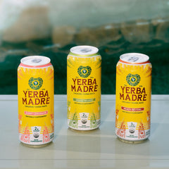 Pack of twelve Guayaki Yerba Madre cans demonstrating quantity and portability