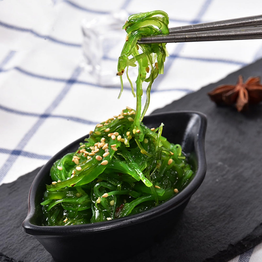 GXXDMZAQ opened pack displaying seasoned wakame ready-to-serve for convenience