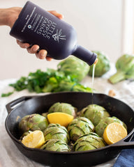 Gypsy Farms pouring oil over salad to show rich flavor and finishing use