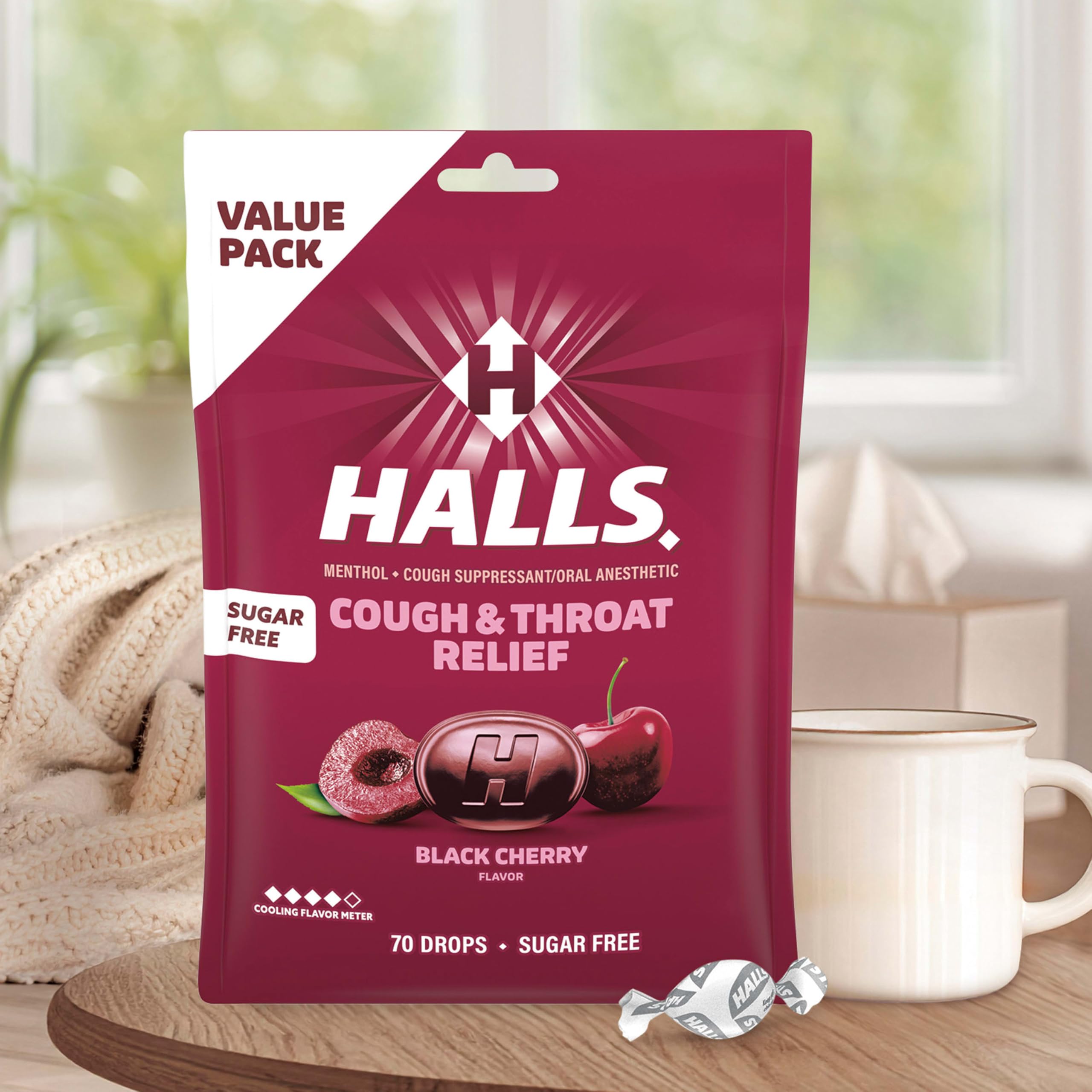 HALLS lozenge next to a coin showing size and easy portioning