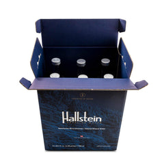 Pouring Hallstein into a glass to show crystal-clear water and smooth mouthfeel