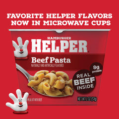 Hamburger Helper sauce being poured over pasta for creamy flavor