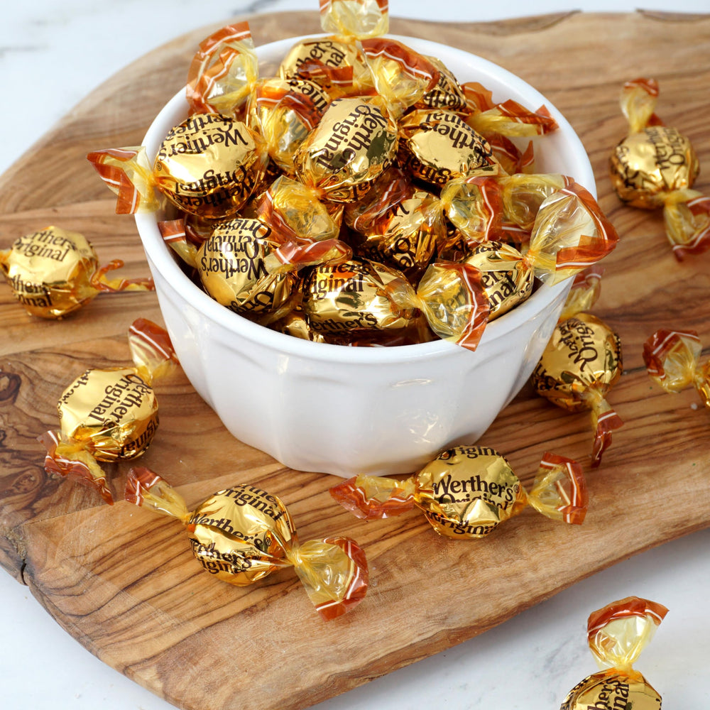 Bulk bag staged with bowl and treats, THE HAMPTON CANDY COMPANY suggesting party use and easy serving