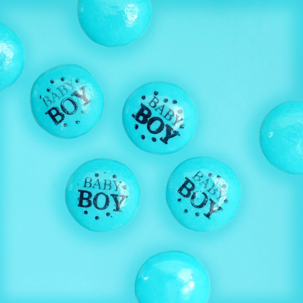 THE HAMPTON CANDY COMPANY blue gum buttons in glass jars on a baby shower candy table, bright decorative impact