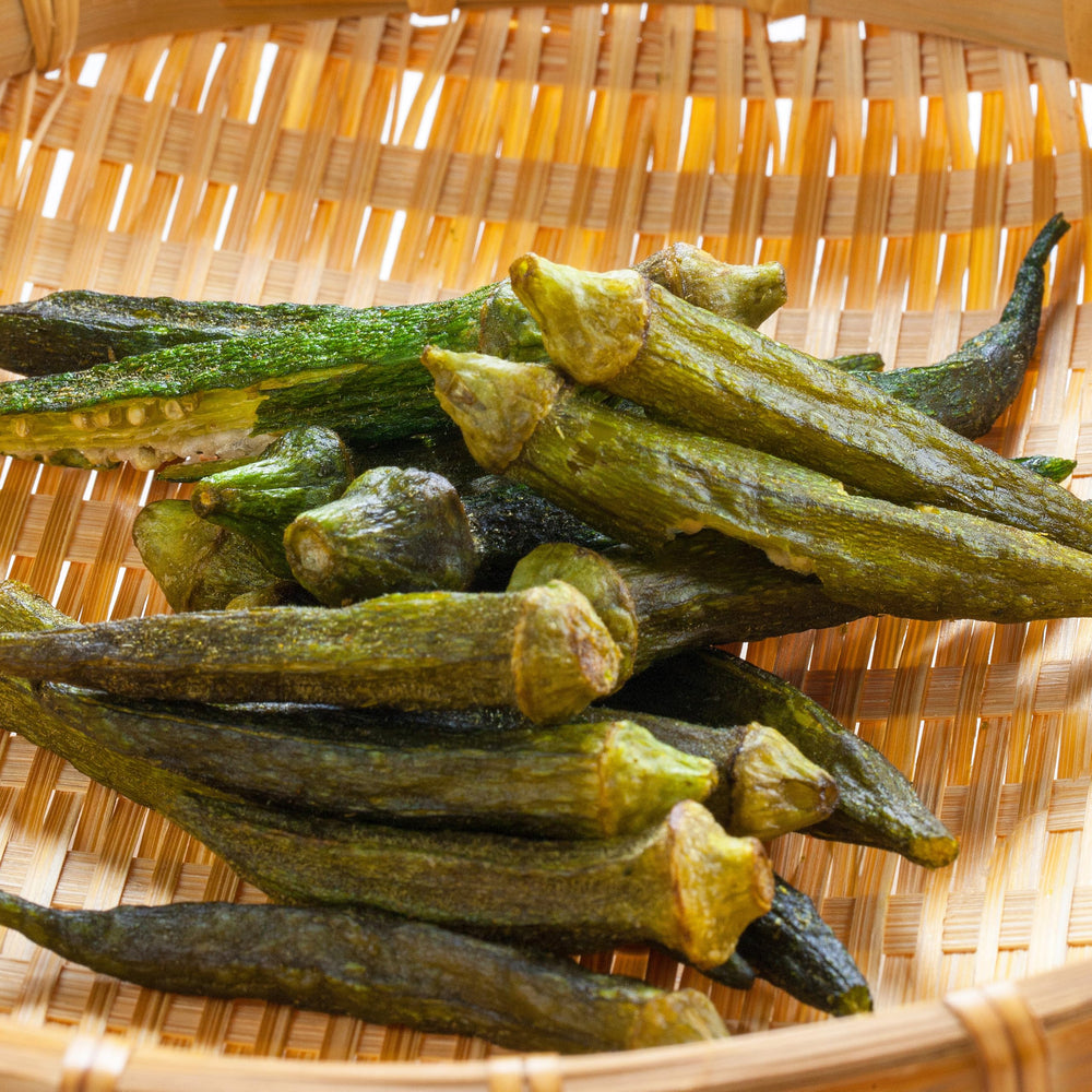 Hampton okra chips beside a measuring cup to show one-pound size and portion convenience