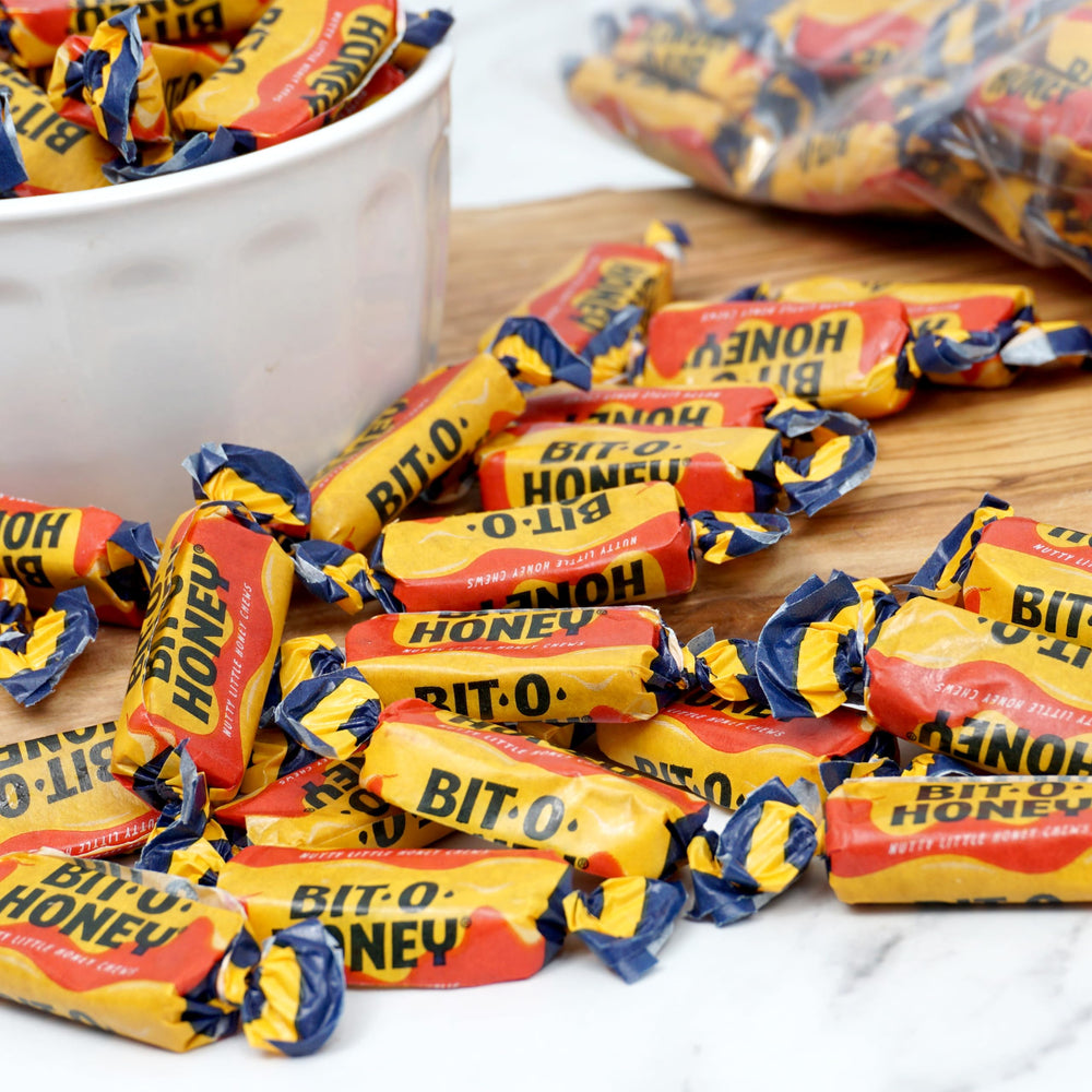 Hand holding BitOHoney candy from The Hampton Popcorn Company to show piece size and scale