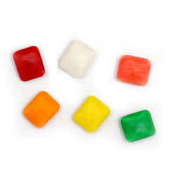 Loading Chiclets into a gumball machine from The Hampton Popcorn Company for reliable refills
