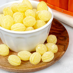 Bulk scoop of Claeys sanded lemon drops by The Hampton Popcorn Company for easy serving