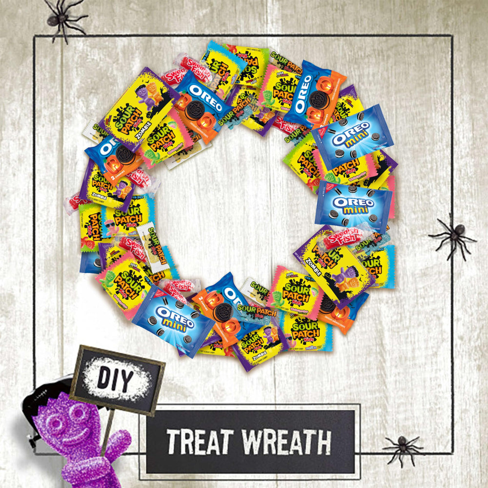 hand holding assorted treat packs featuring Sour Patch Kids for easy handing out and travel