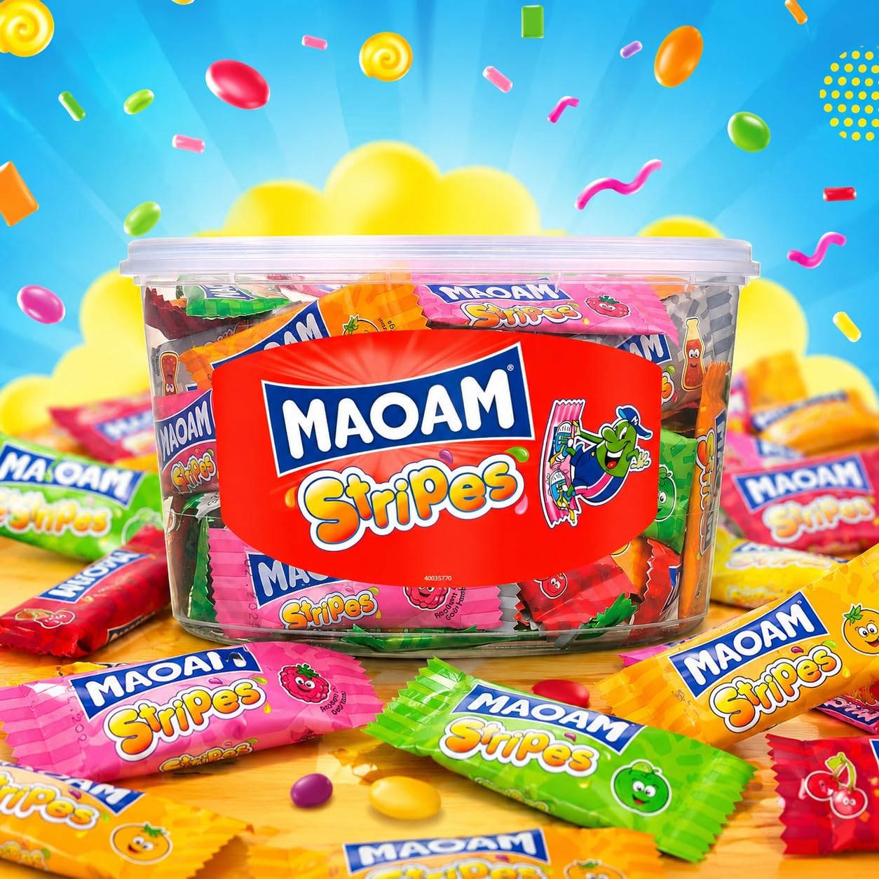 Hand holding a MAOAM Strip next to tub showing Haribo portion size and scale