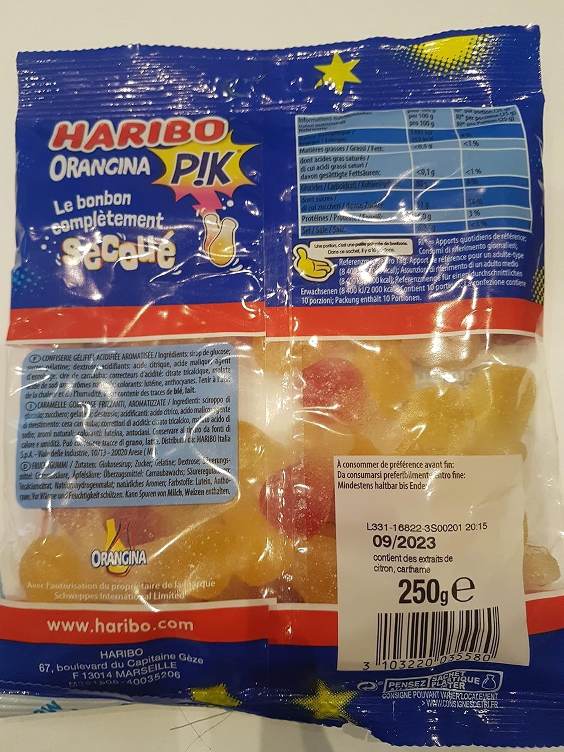 Haribo close-up of sour sugar coating and chewy texture, highlights tangy bite