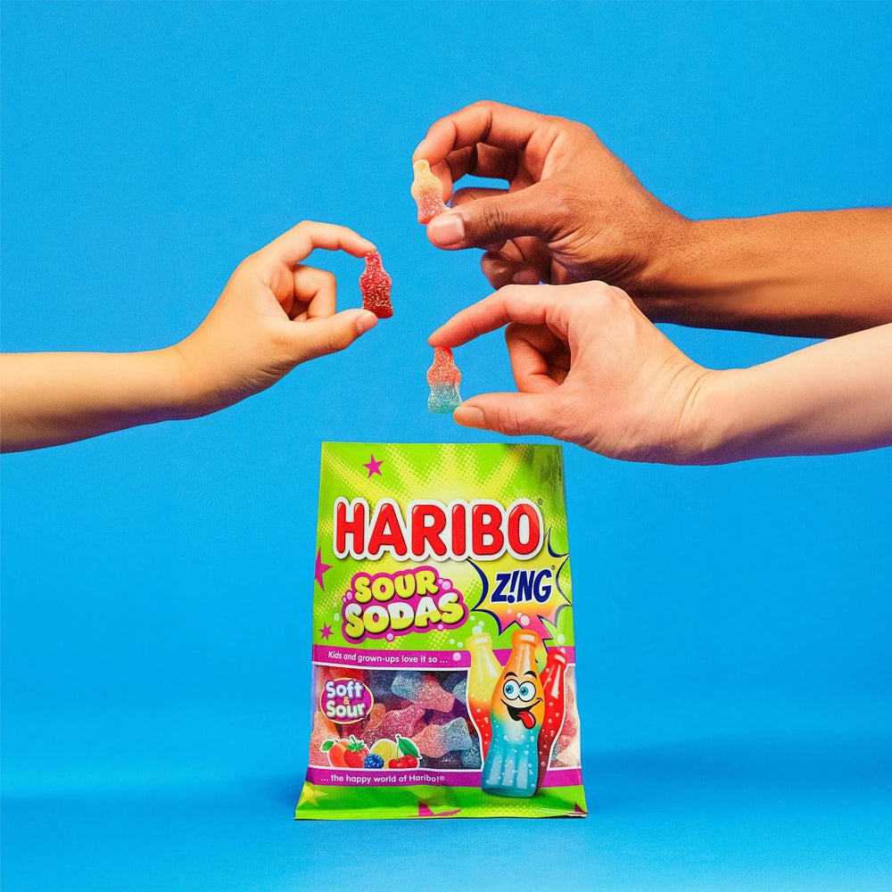 Haribo Sour Sodas held in hand to show bag size and portion convenience