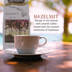 HAWAIIAN ISLES COFFEE in-hand 8 oz bag showing portable size and freshness benefit