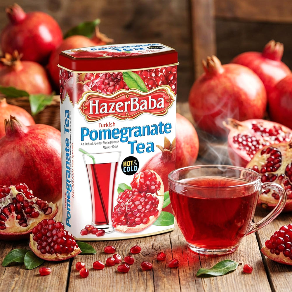 HazerBaba with fresh pomegranate fruit showing natural flavor inspiration