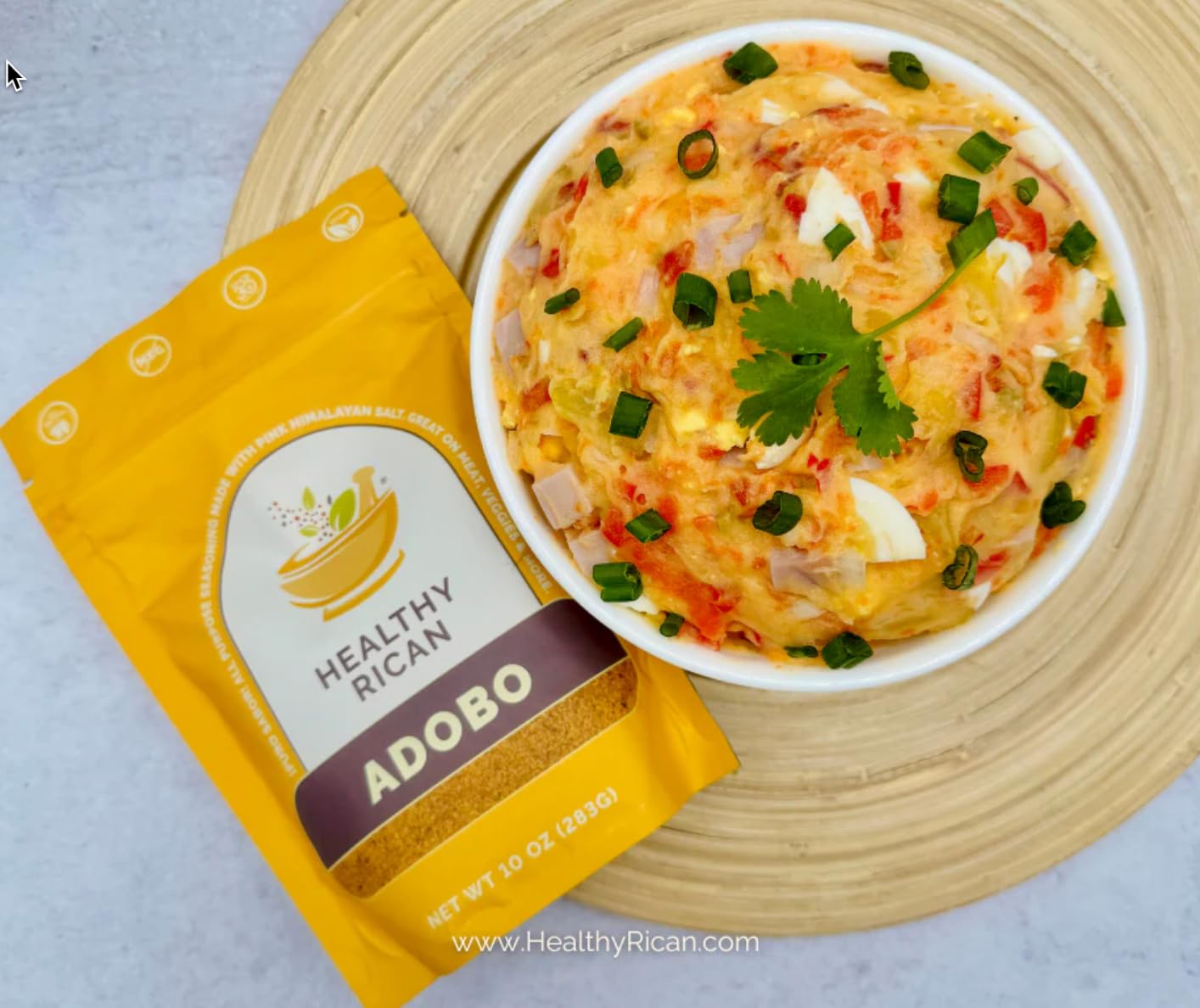 Healthy Rican pouch on a kitchen counter alongside cooked rice and vegetables
