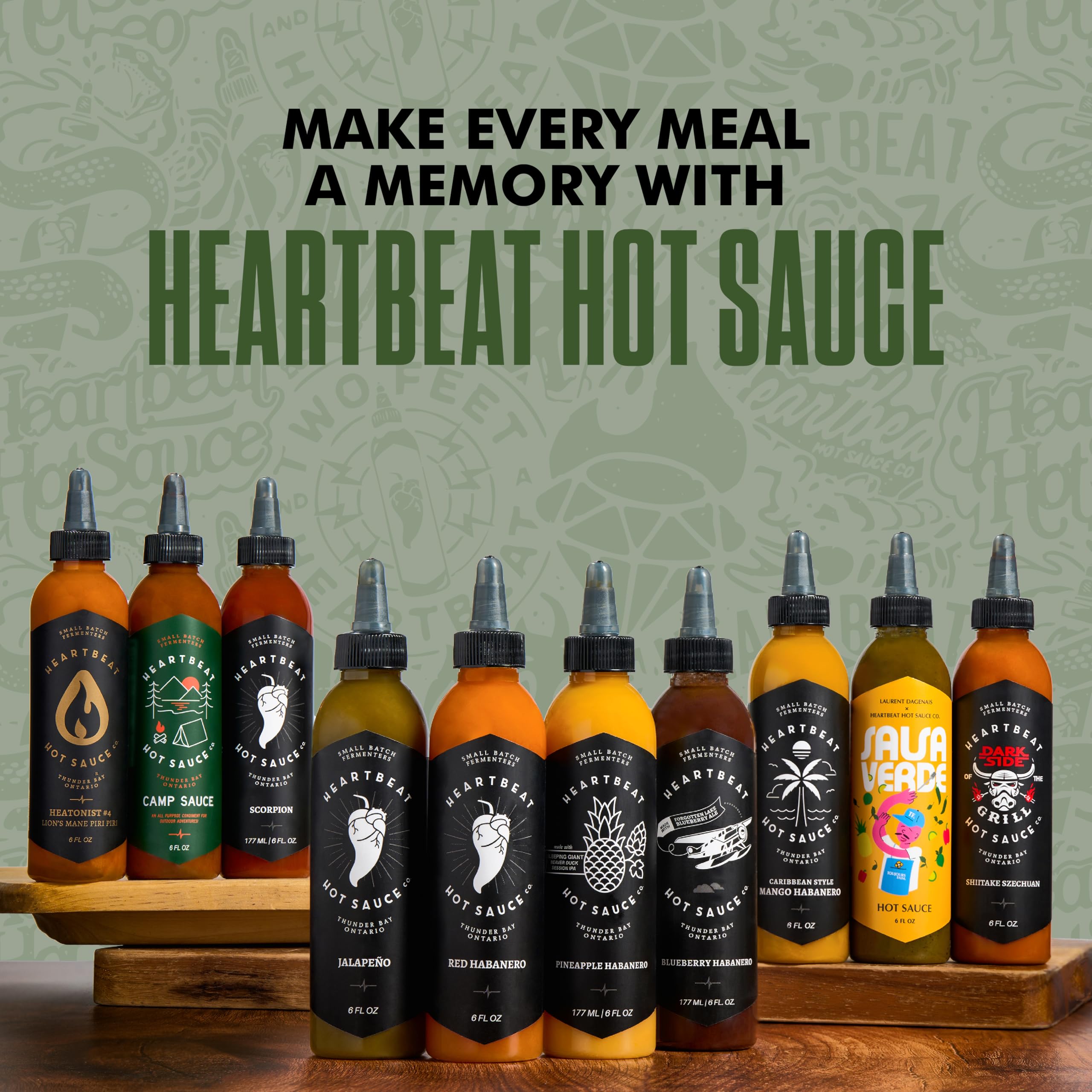 HEARTBEAT HOT SAUCE CO. bottle beside campfire and skillet suggesting outdoor meal pairing