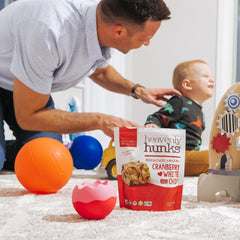Heavenly Hunks ingredients display with cranberries and white chips — emphasizes real ingredients
