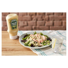 HEINZ creamy pour texture from bottle emphasizing smooth coating benefit