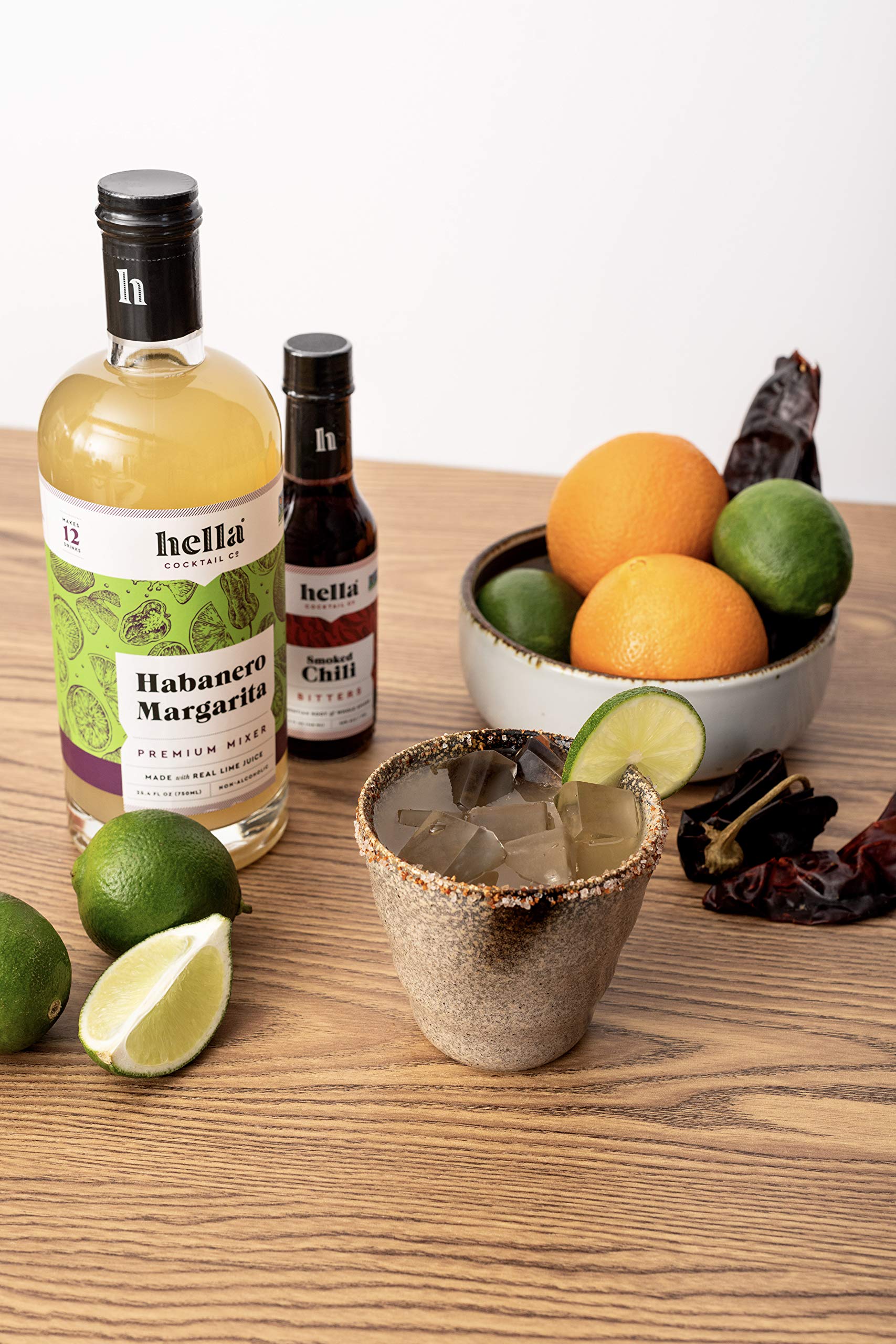 Hella Cocktail Co. pitcher at a party demonstrating easy batching for entertaining