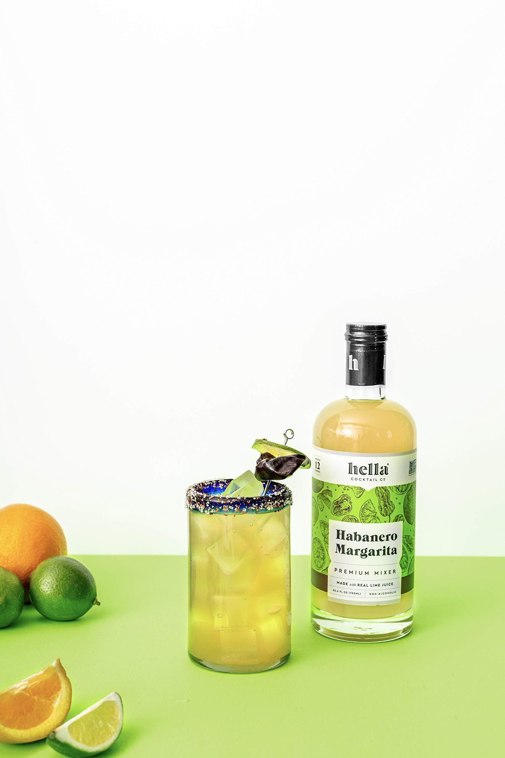 Hella Cocktail Co. margarita on the rocks with lime garnish showcasing ready-to-serve convenience