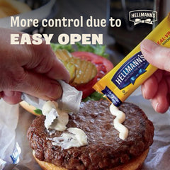 Hand holding Hellmann's single-serve packet for scale and easy portion control