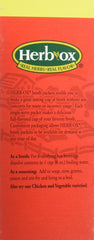 Herb-ox single packet beside a cup of prepared broth illustrating fast, salt-free flavor