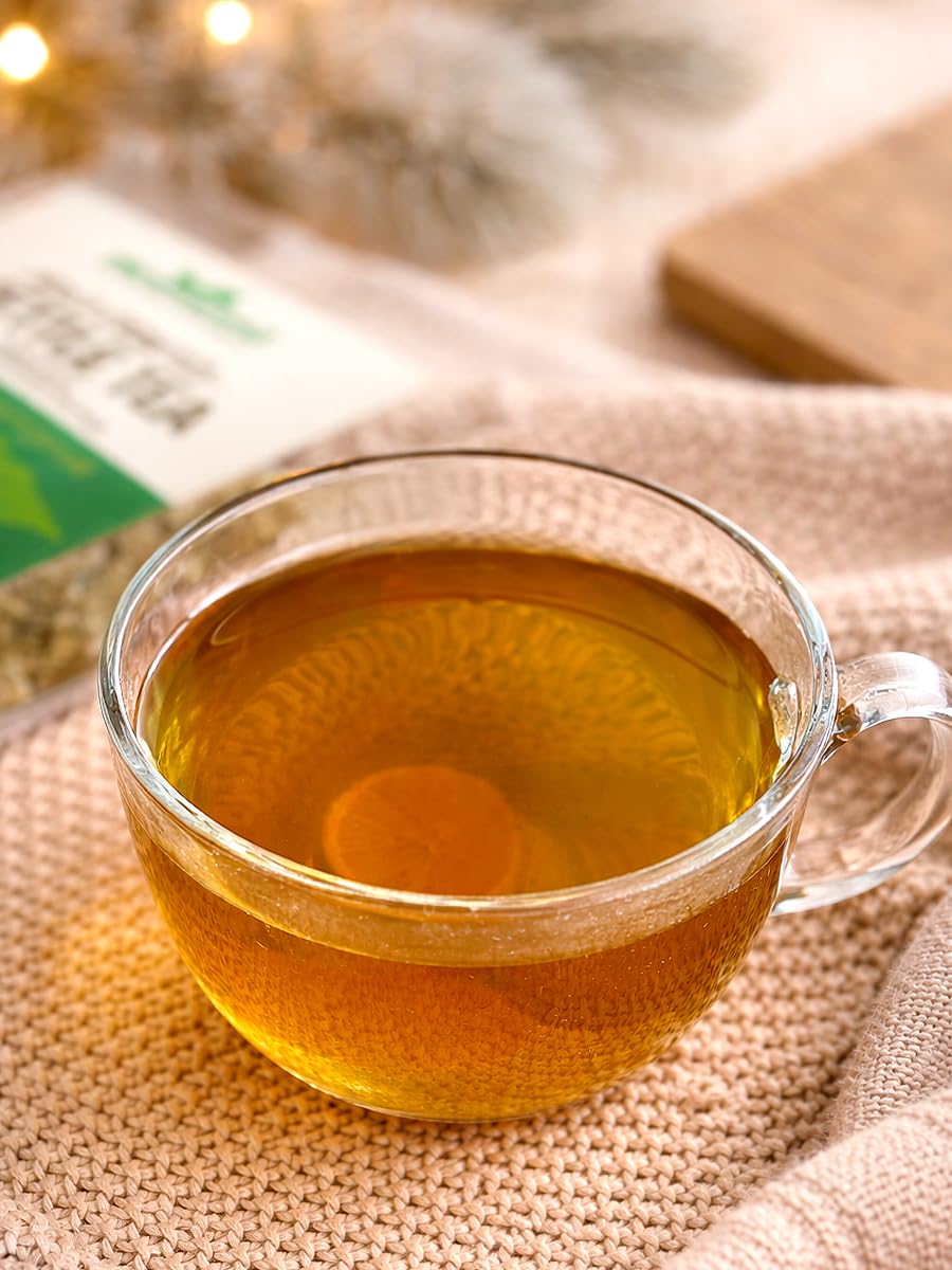 Brewed cup of HerbaZest muña tea, steaming and calming for daily use