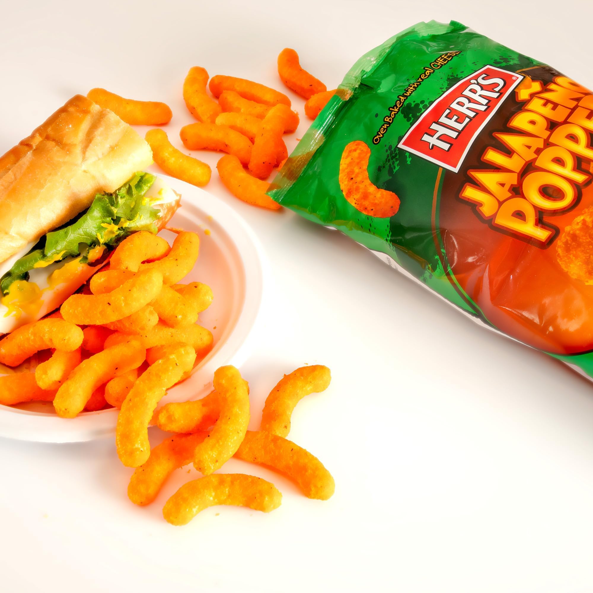 Herr's cheddar and jalapeño ingredients staged to show real cheese flavor