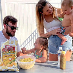 Herr’s popcorn in a bowl in a casual living room setting for sharing
