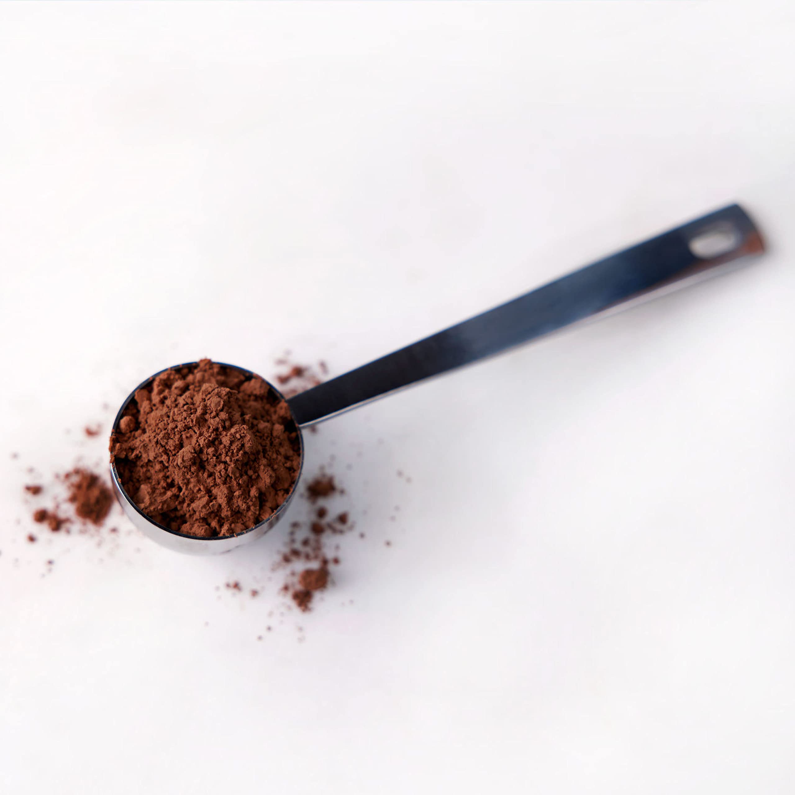 HERSHEY'S cocoa in a kitchen baking scene showing versatile holiday dessert use
