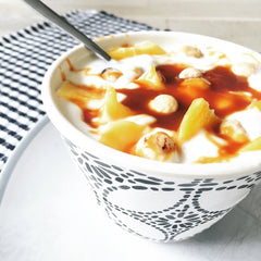 Hey Boo caramel pouring over vanilla ice cream offering rich dessert enhancement
