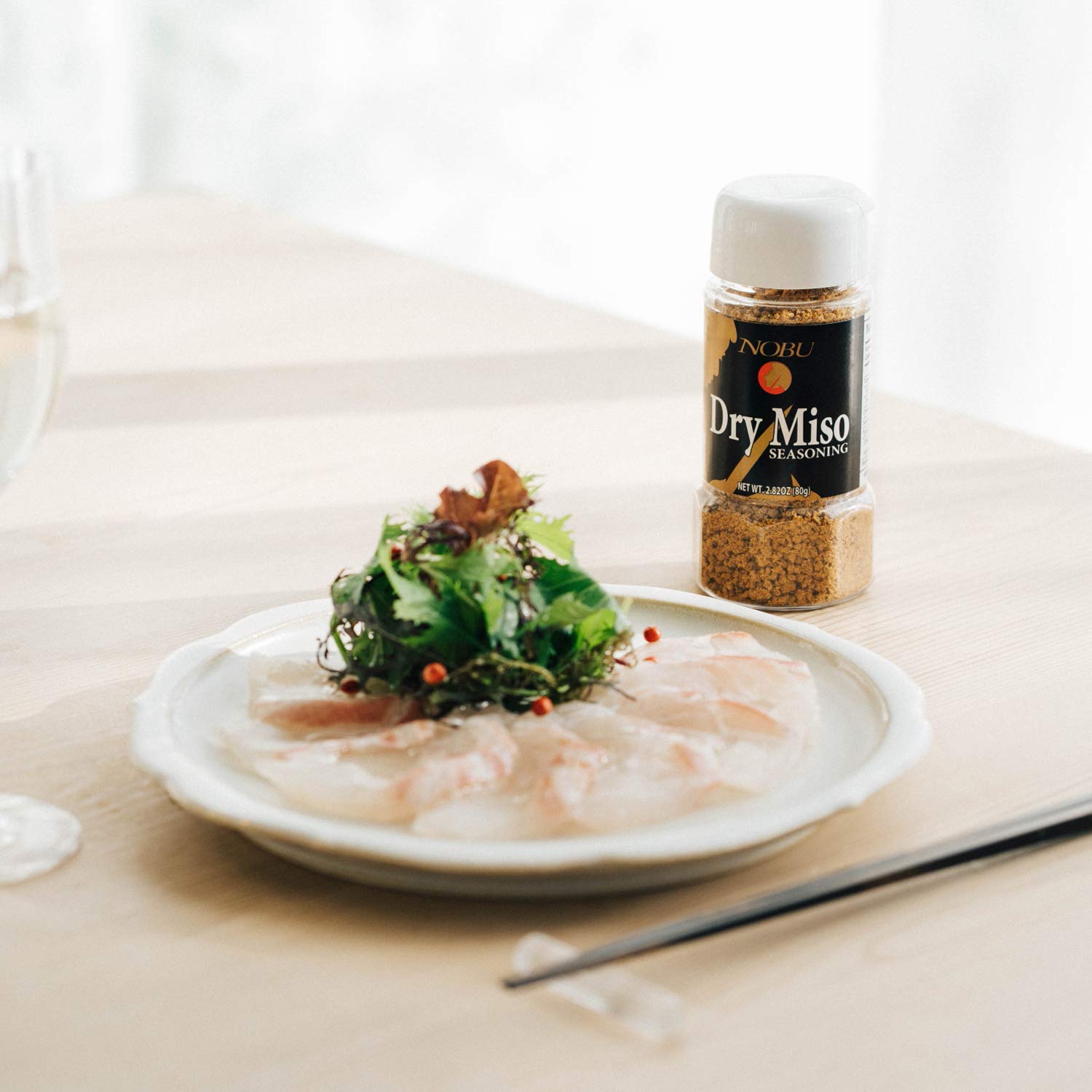 Hikari Miso granulated seasoning dusted on grilled fish enhancing savory crust and presentation