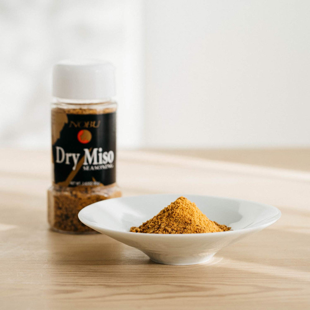 Hikari Miso dry miso flakes sprinkled on salad adding immediate umami and bright finishing flavor