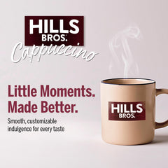 Hills Bros served hot cappuccino in a mug with foam demonstrating frothy, café-style result