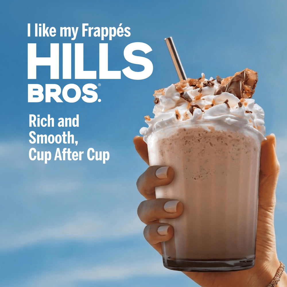 Hills Bros Vanilla Crème packet in hand demonstrating single-serve size