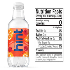 Hint cranberry orange bottle in hand demonstrates portable hydration convenience