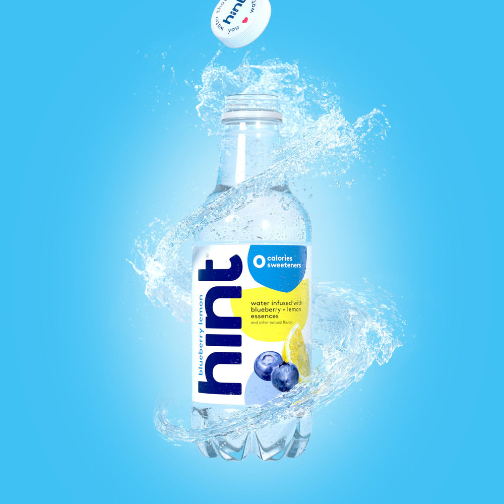 Hint bottle in outdoor setting showing portable hydration on-the-go benefit