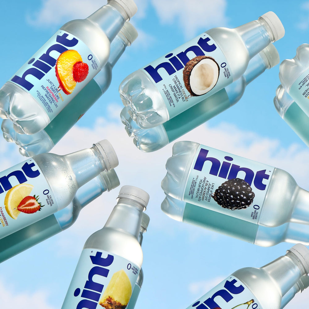 Lifestyle picnic with Hint bottles demonstrating convenient, tasty hydration outdoors