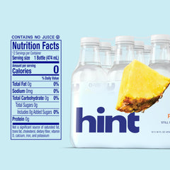 Hint pineapple poured into glass showing clear water and bright aroma