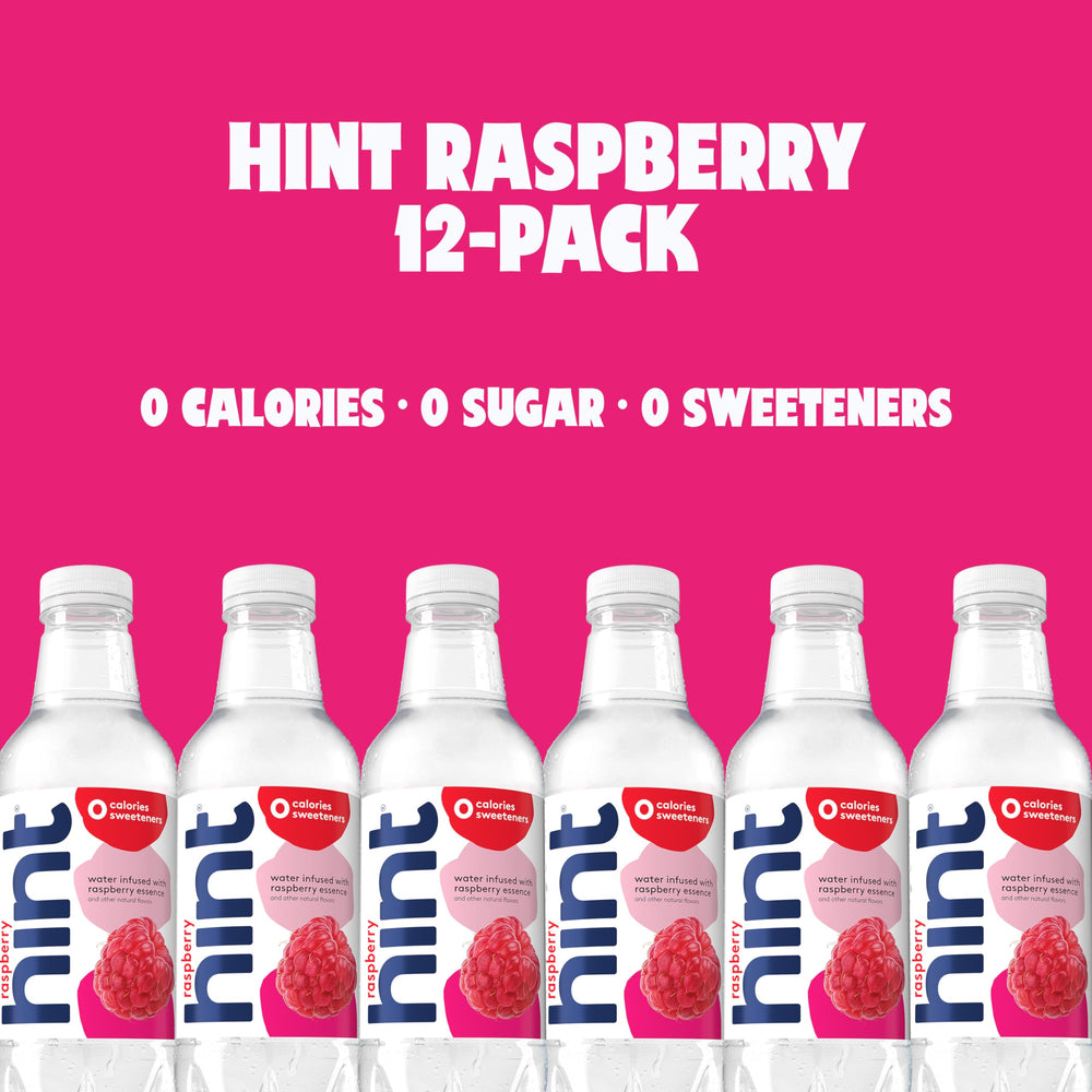 Glass poured from Hint raspberry bottle over ice showing refreshing chilled benefit