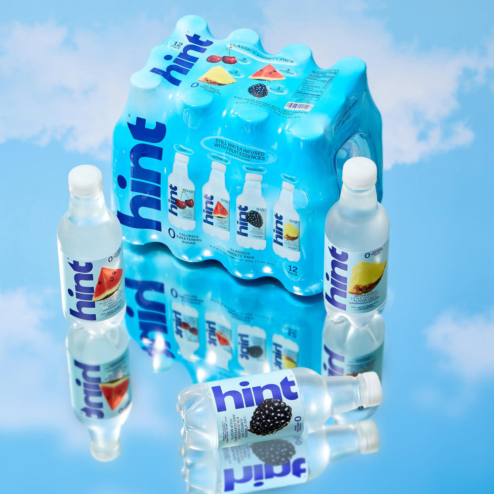 Hint bottle held in hand offering scale and easy portability benefit