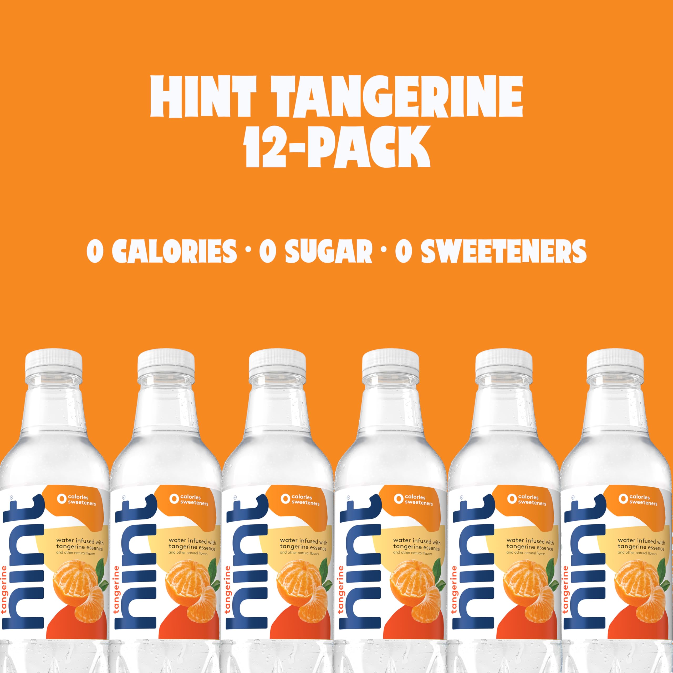 Hand holding Hint tangerine bottle demonstrating portable hydration benefit