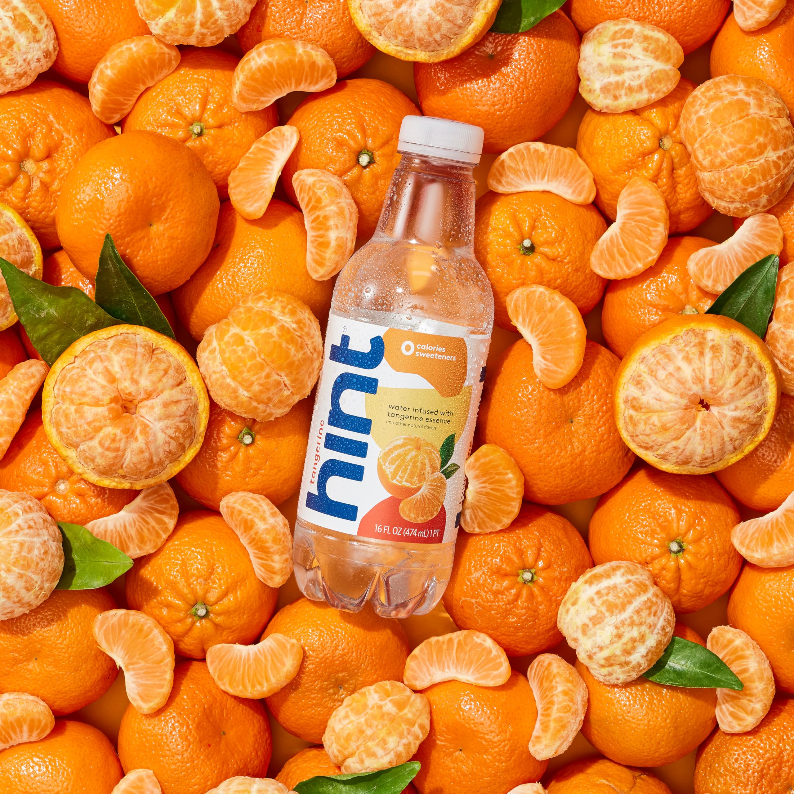 Hint tangerine bottle on a desk conveying convenience and focus benefit
