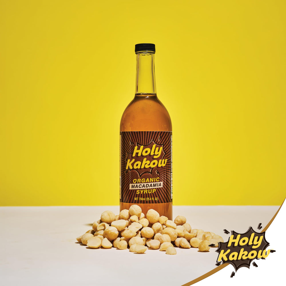 Holy Kakow bottle held in hand to show 750 ml scale and serving size