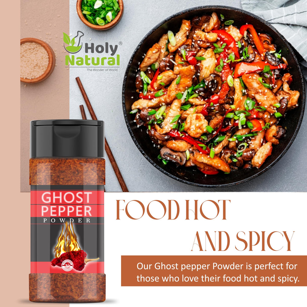 Wooden spoon sprinkling Holy Natural ghost pepper powder to add controlled heat