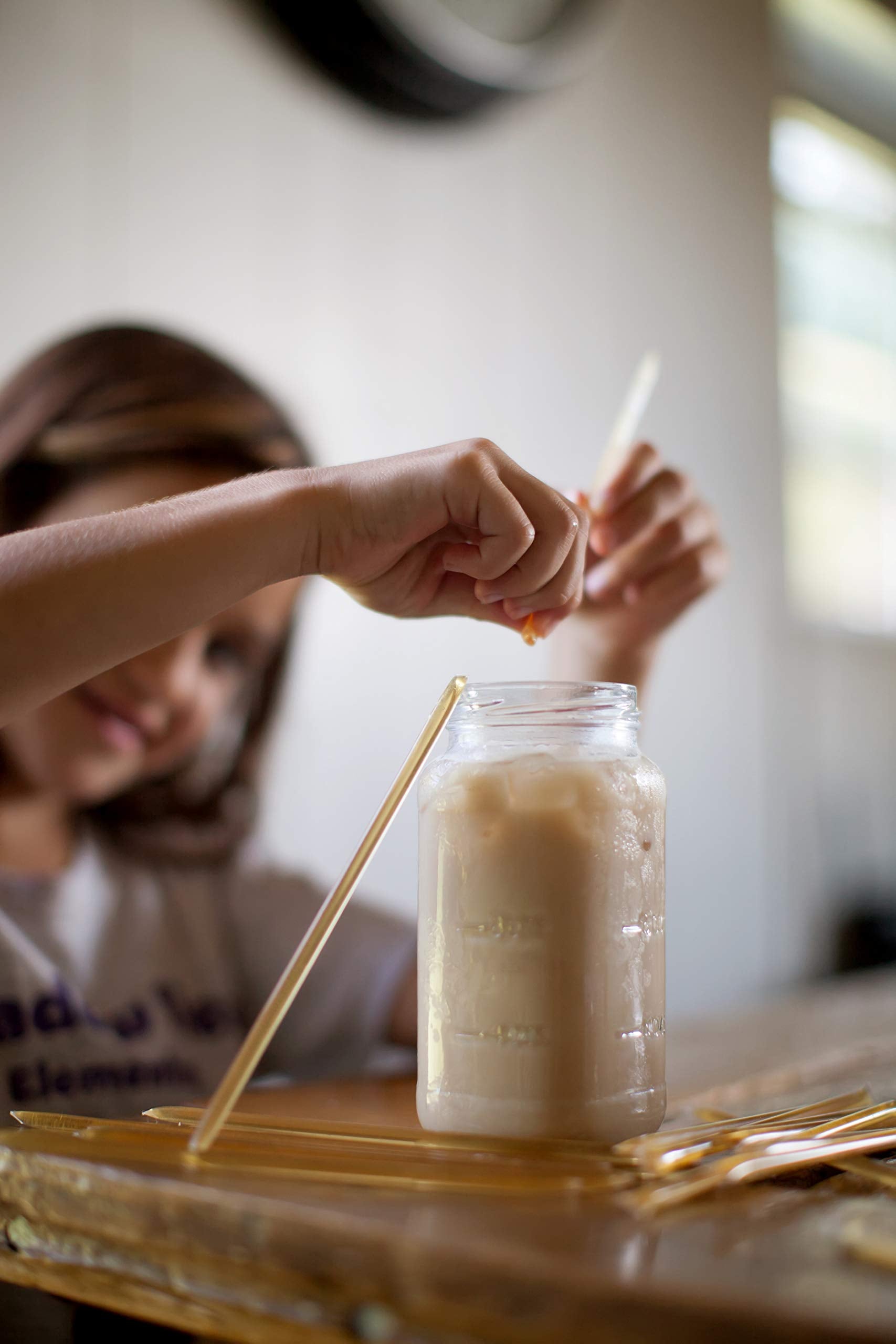 Honey Acres straw held in hand illustrating portable single-serve portion