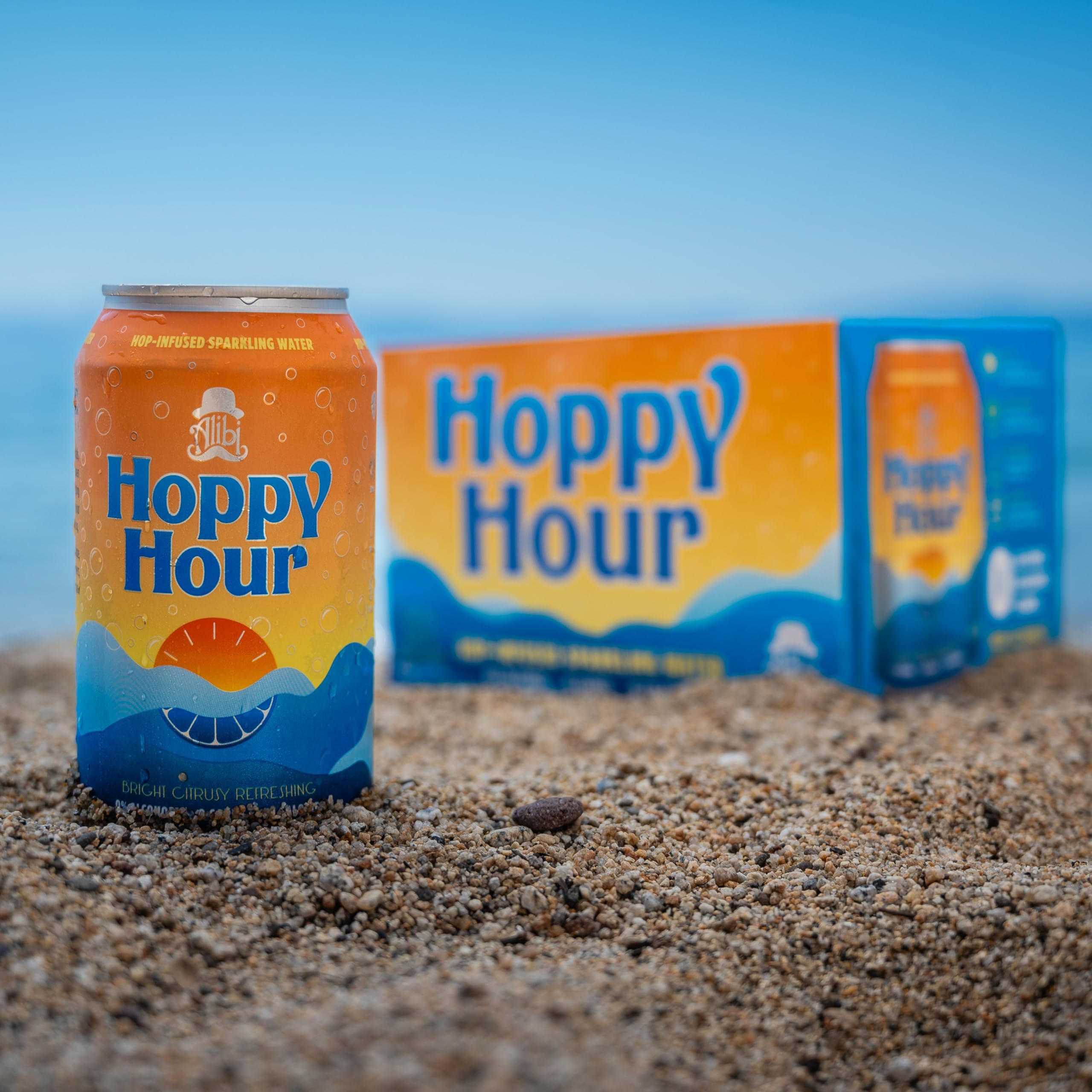 Hoppy Hour stacked cans emphasizing recyclable packaging and clean ingredients