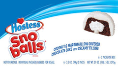 Hostess Snoballs served on a plate beside coffee illustrating a convenient party or snack pairing